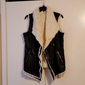Black faux leather vest with faux fur lining